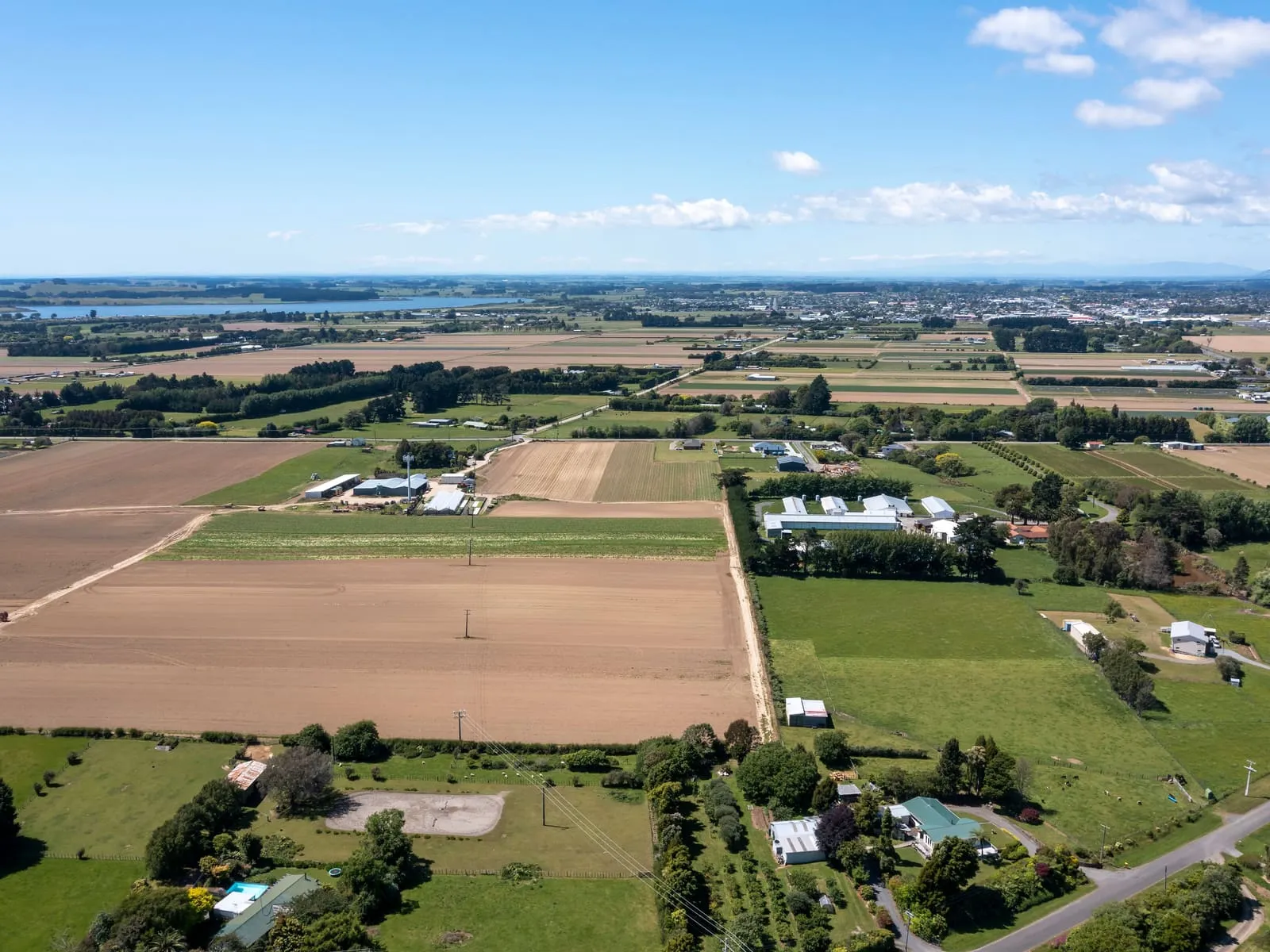 Aerial view of farmland and a small New Zealand town